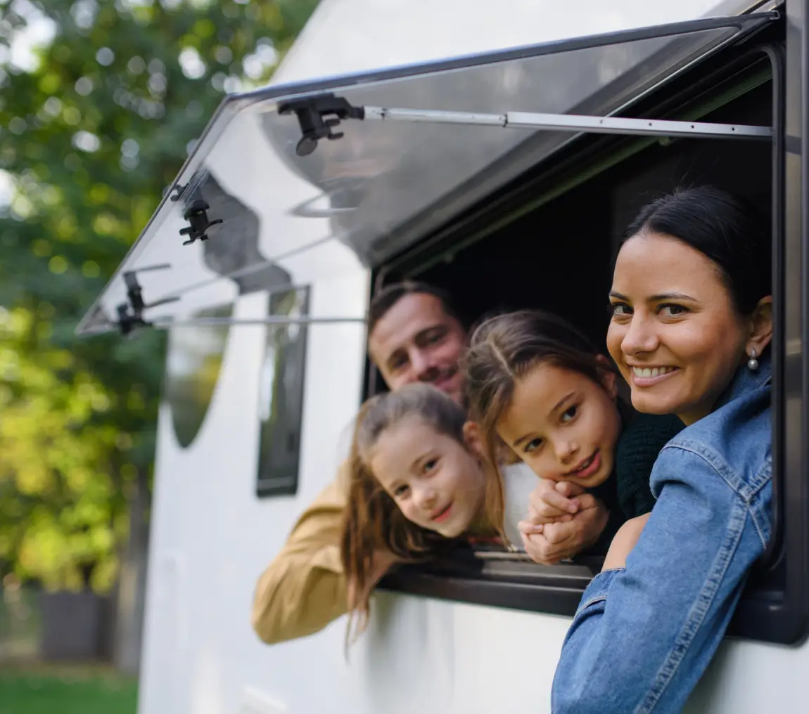 Happy family enjoying camper trip